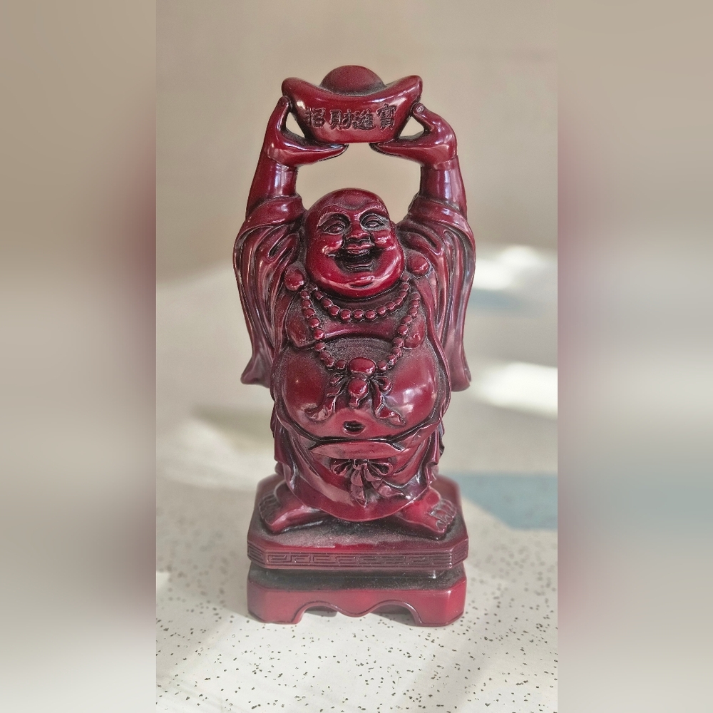Smiling Buddha red resin statue